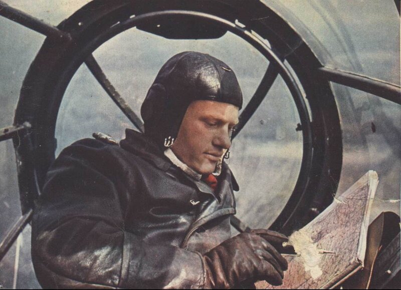 pilot in cockpit with map