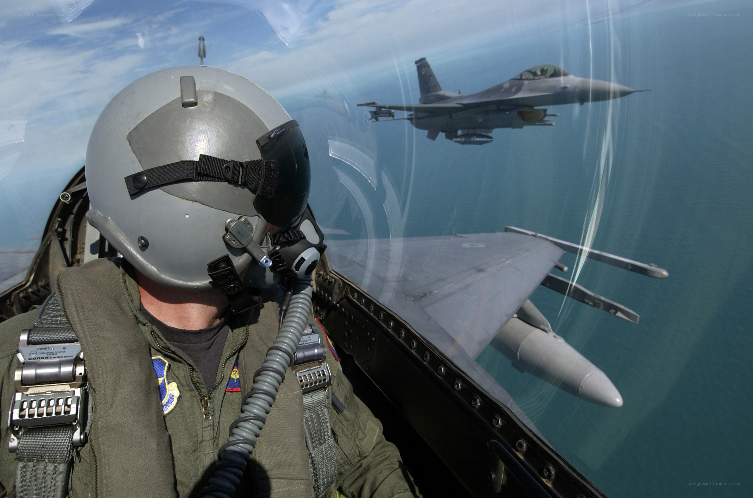 Pilot in fighter jet cockpit