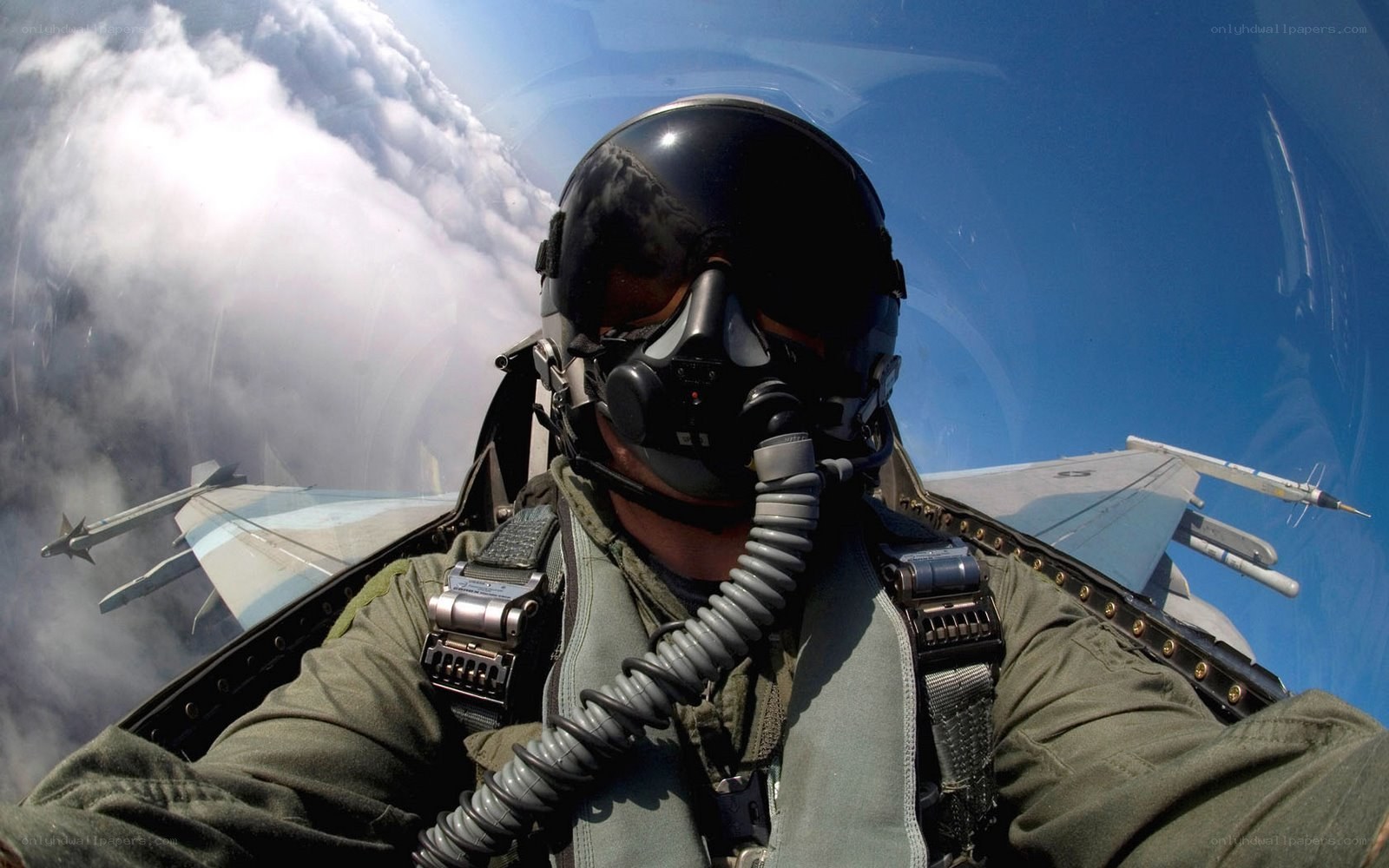 pilot in fighter jet cockpit