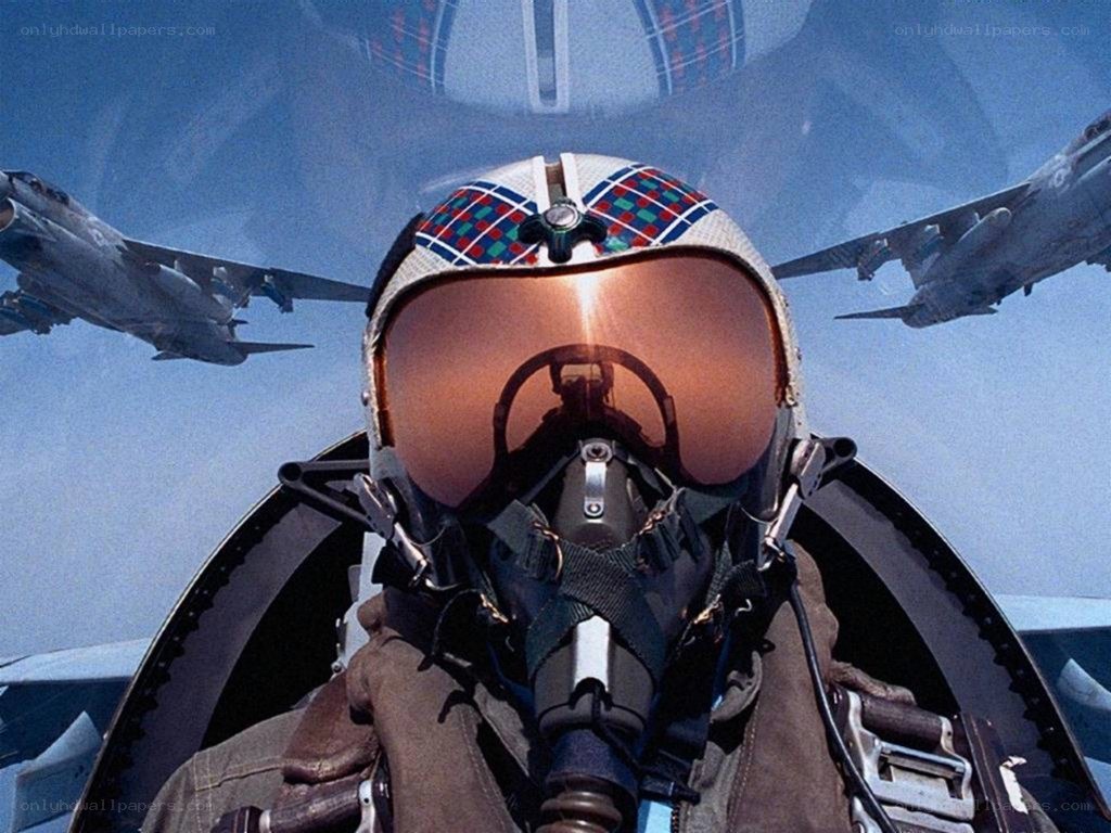 pilot in fighter jet cockpit