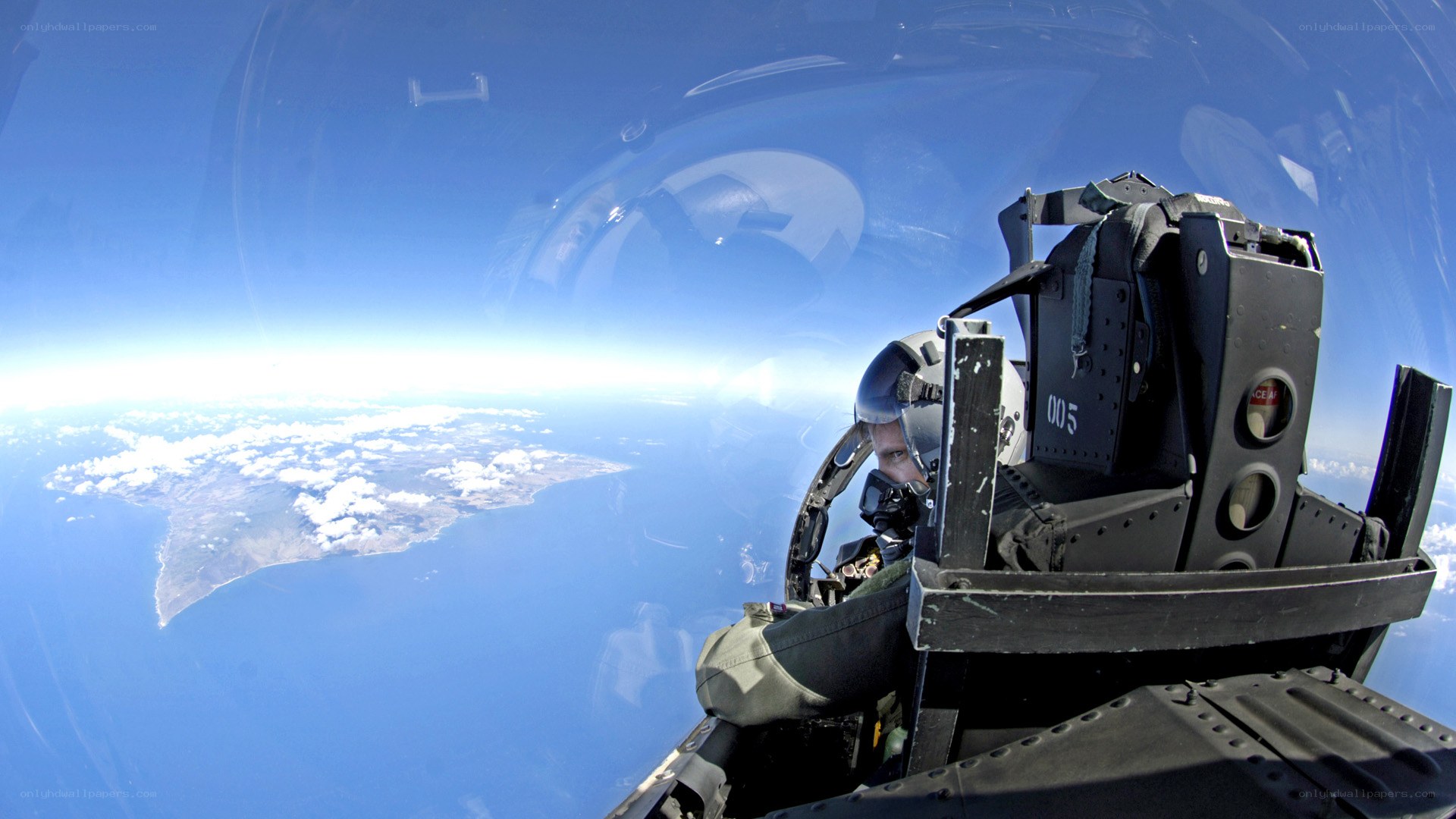 Pilot in fighter jet cockpit