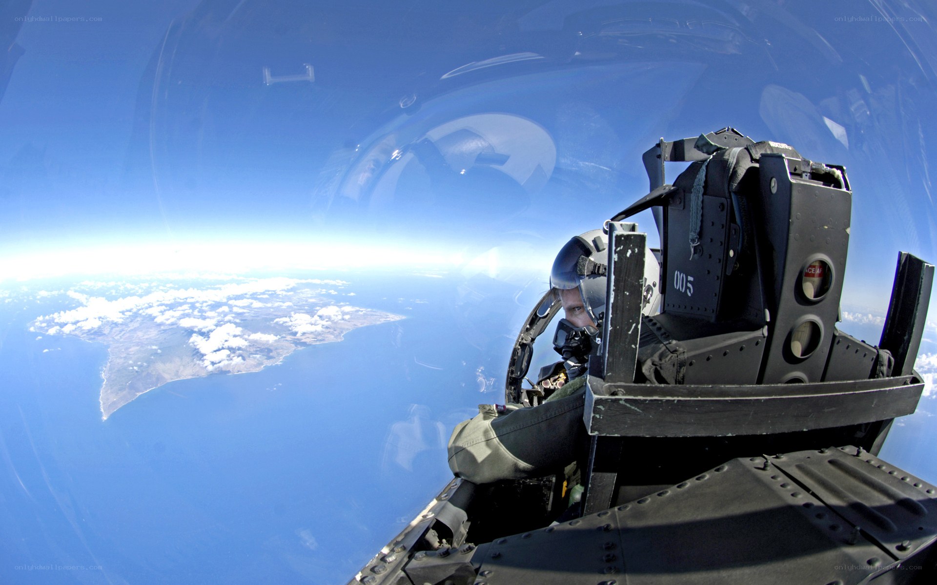 Pilot in fighter jet cockpit