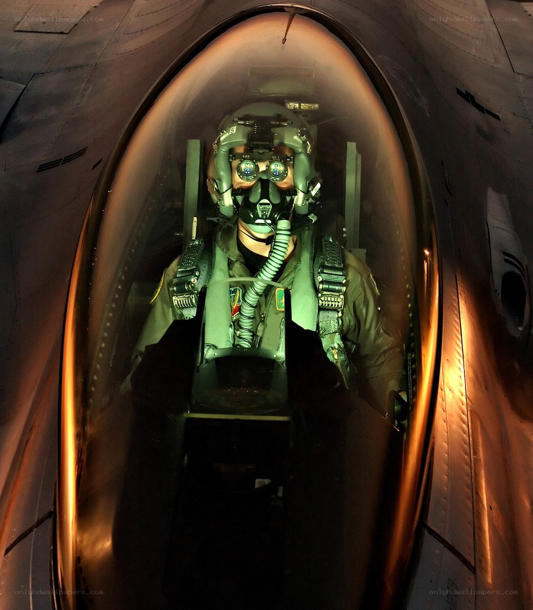 Pilot in fighter jet cockpit