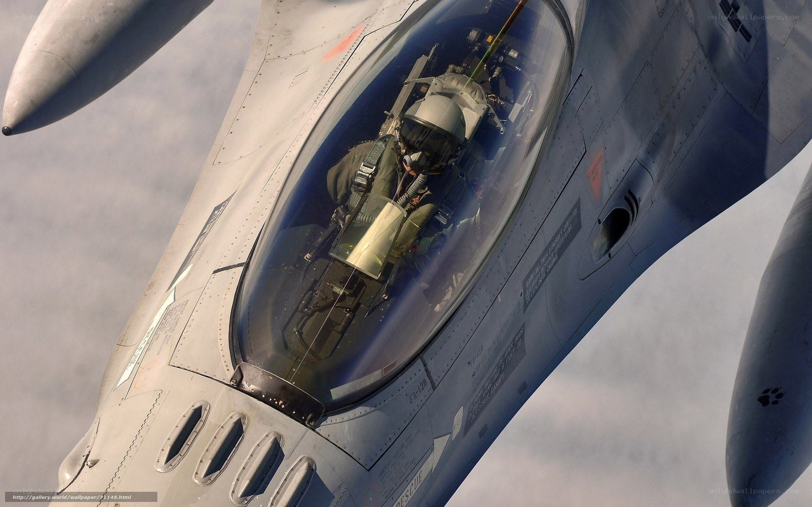 Pilot in fighter jet cockpit