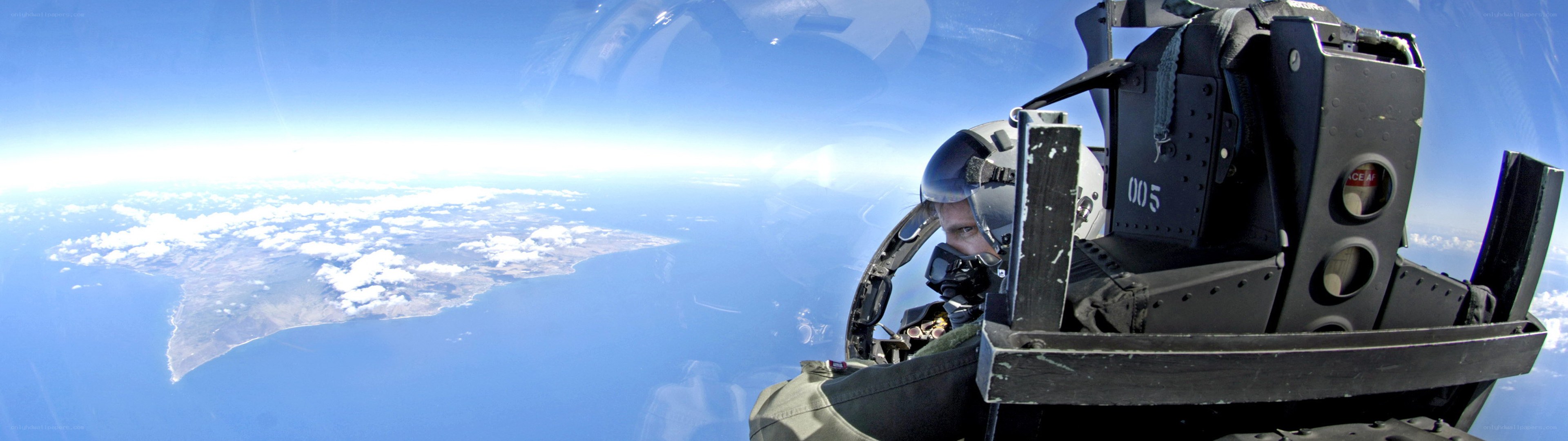 Pilot in fighter jet cockpit