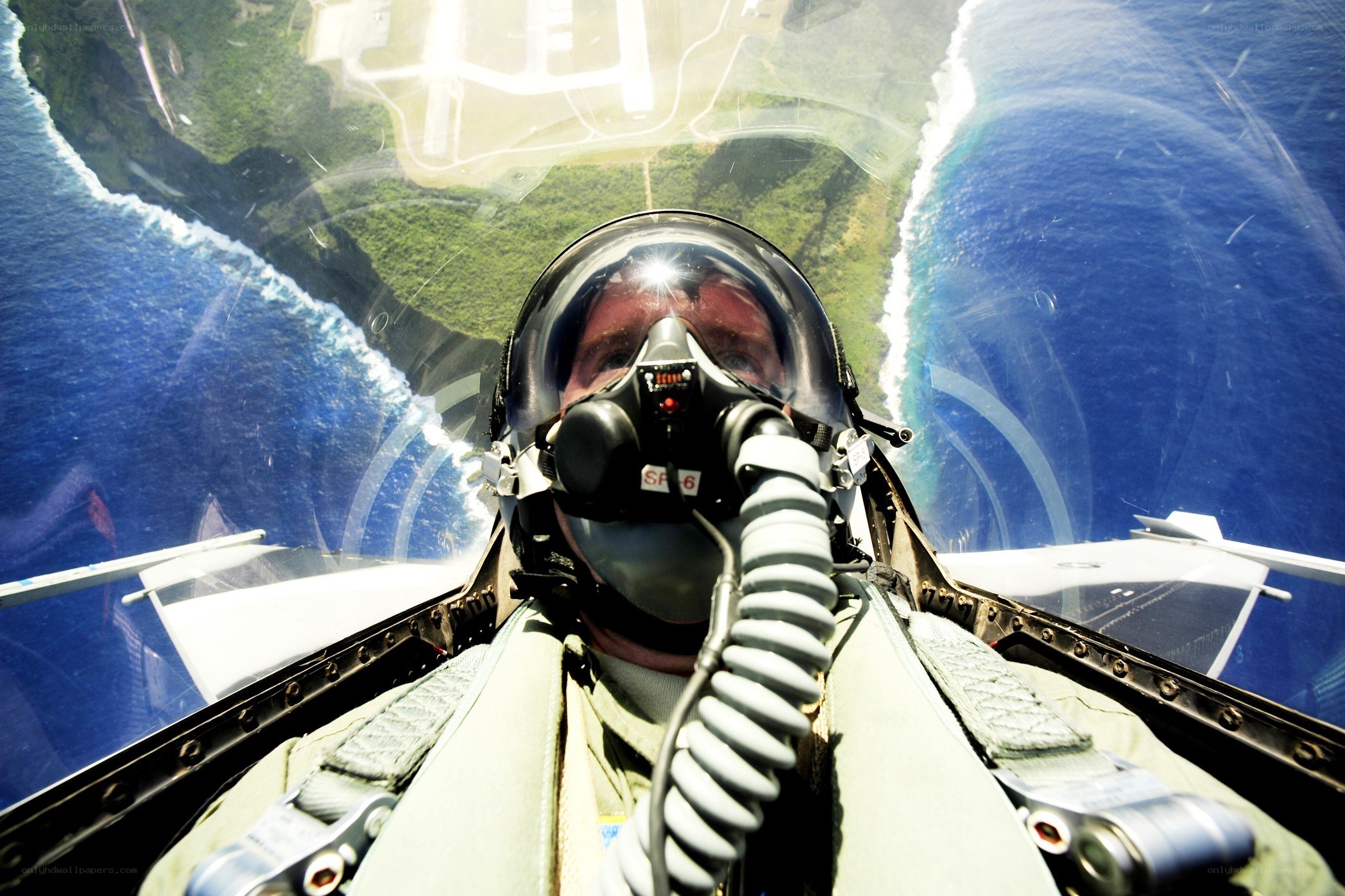 pilot in fighter jet cockpit
