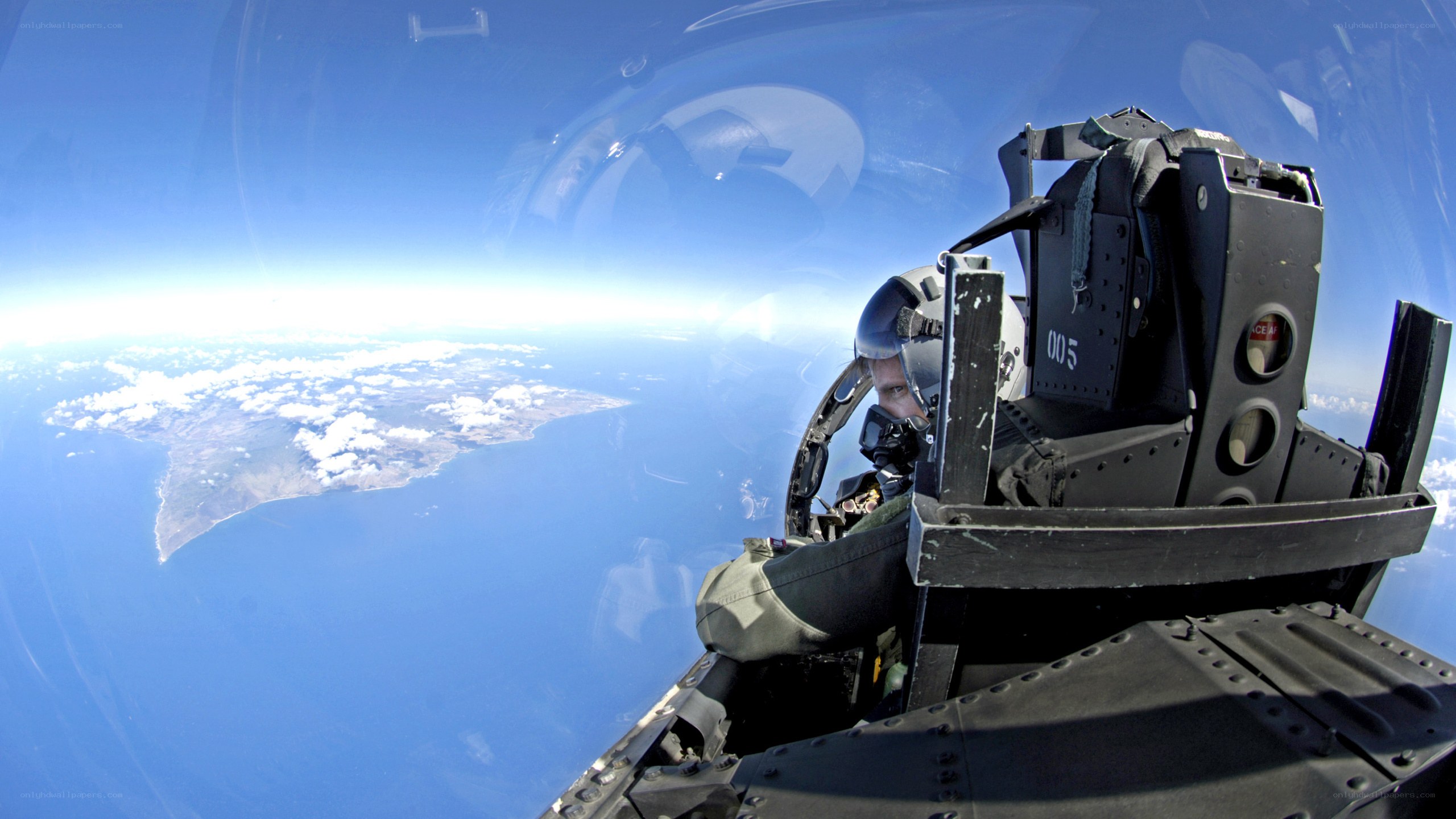 Pilot in fighter jet cockpit