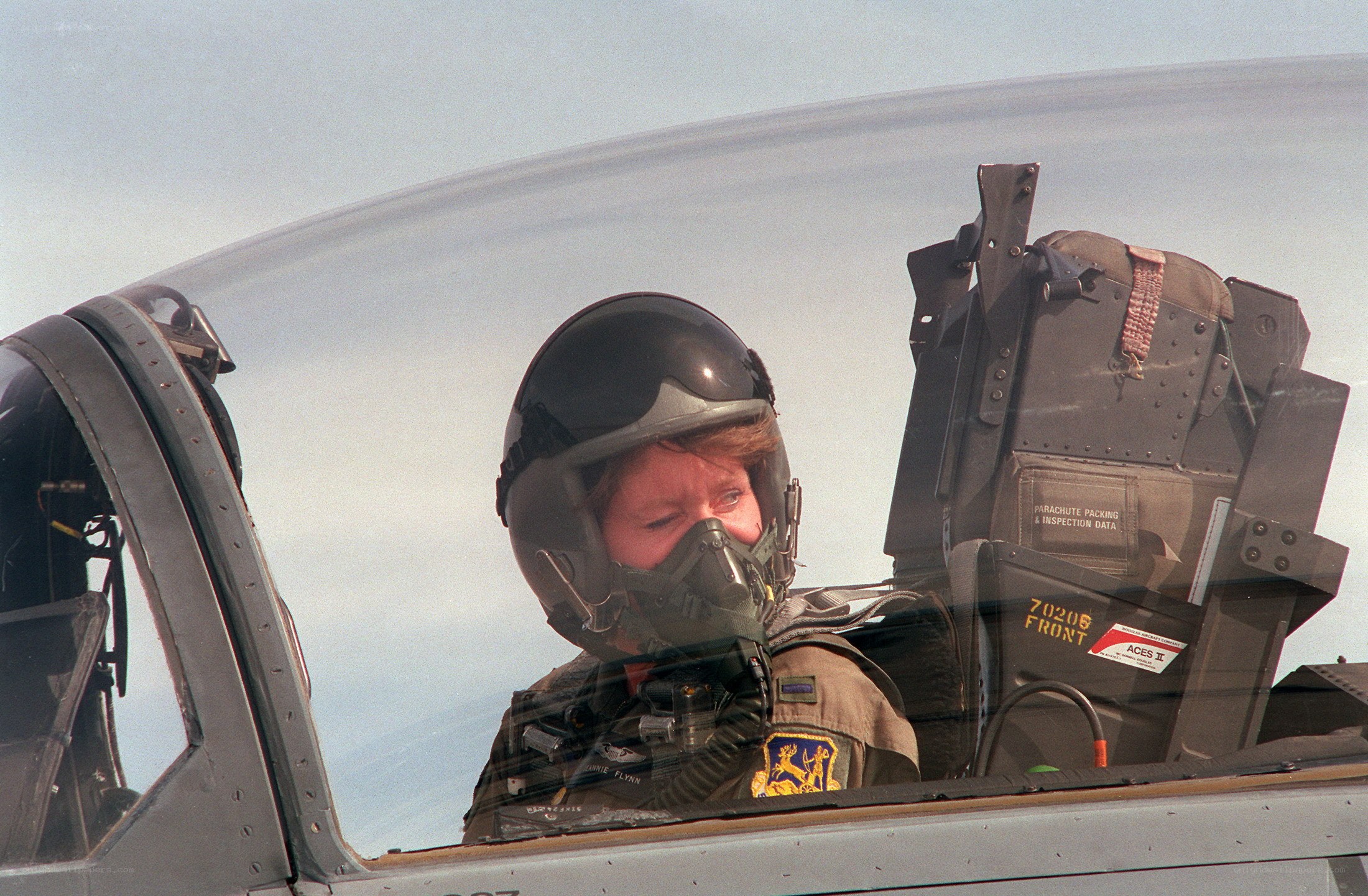 Pilot in fighter jet cockpit