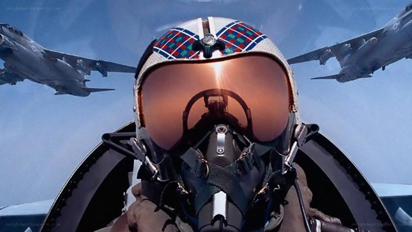 pilot in fighter jet cockpit
