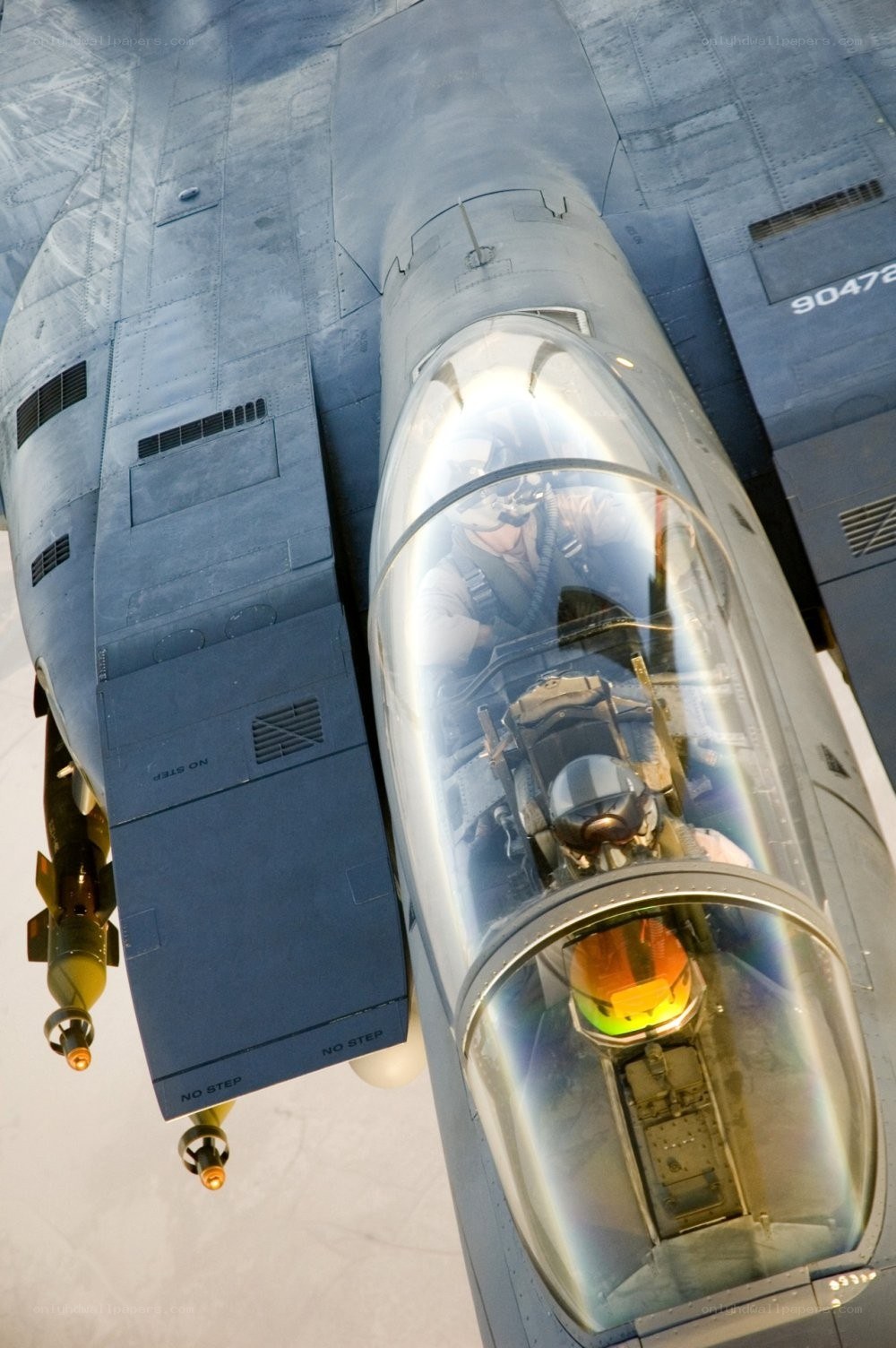 Pilot in fighter jet cockpit