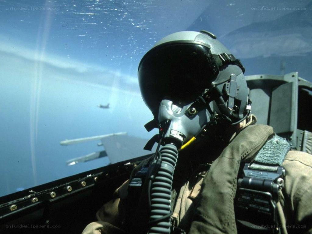 Pilot in fighter jet cockpit
