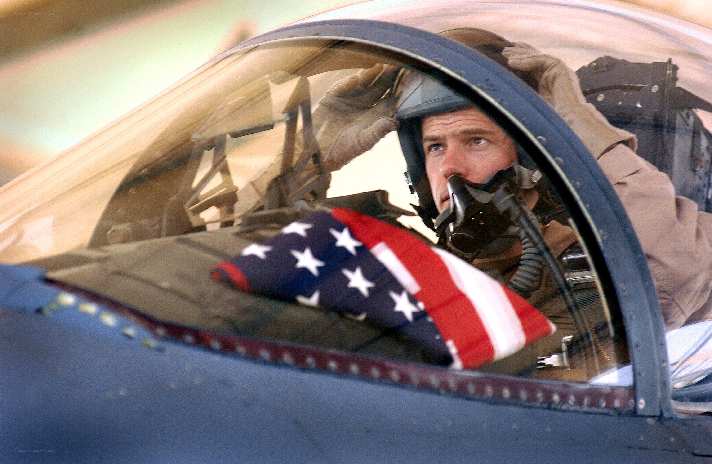Pilot in fighter jet cockpit