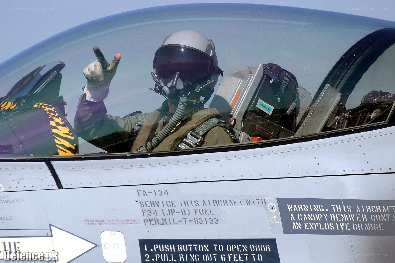 Pilot in fighter jet cockpit