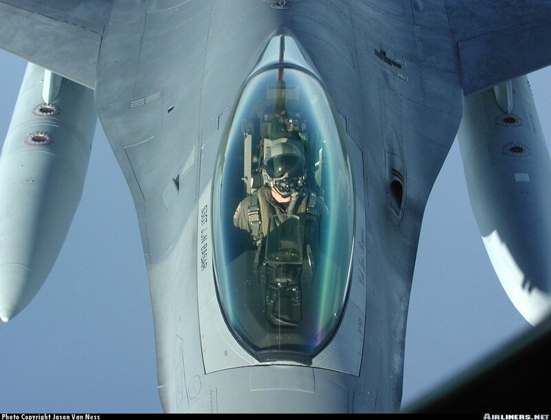 Pilot in fighter jet cockpit