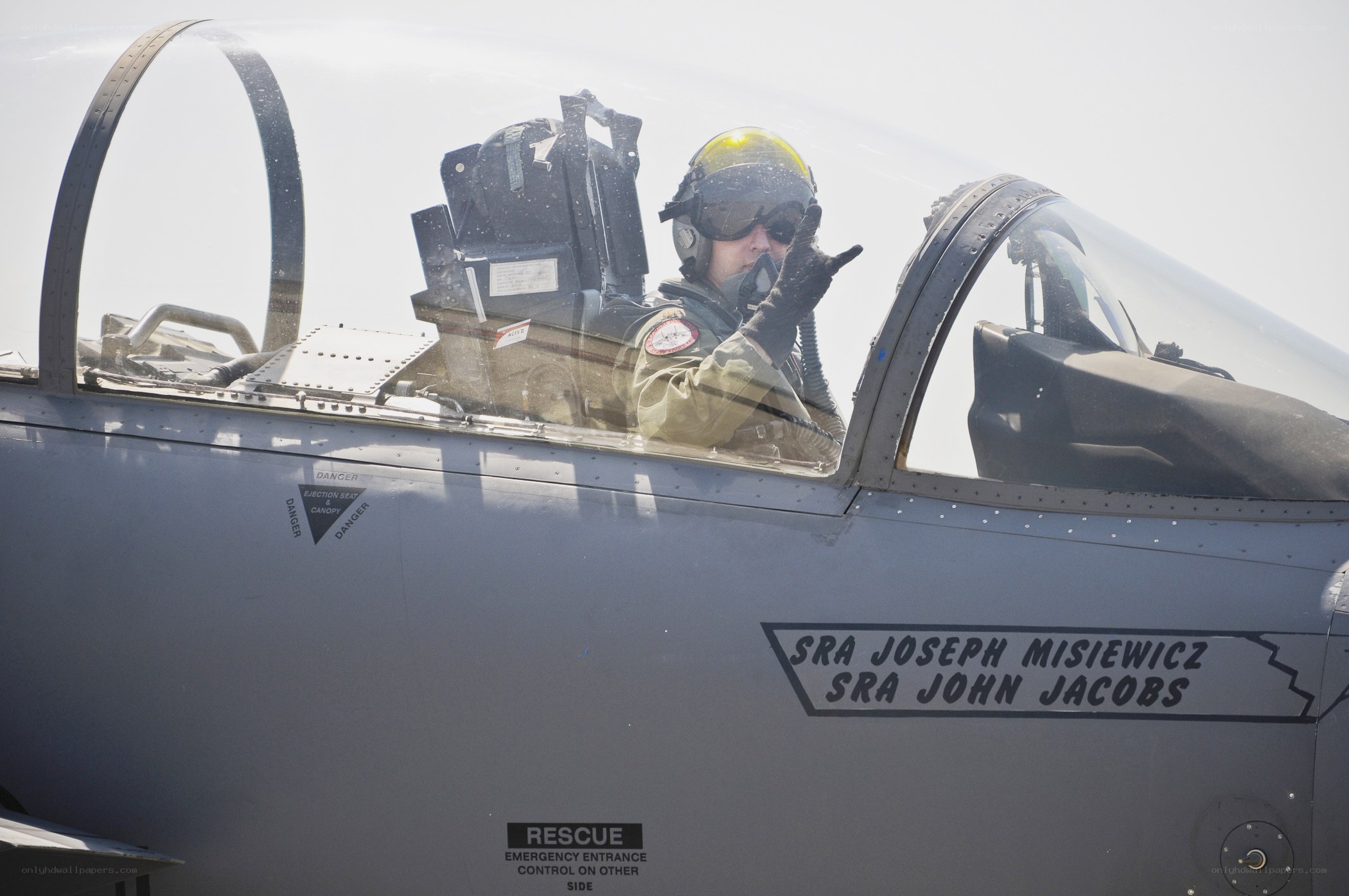 Pilot in fighter jet cockpit