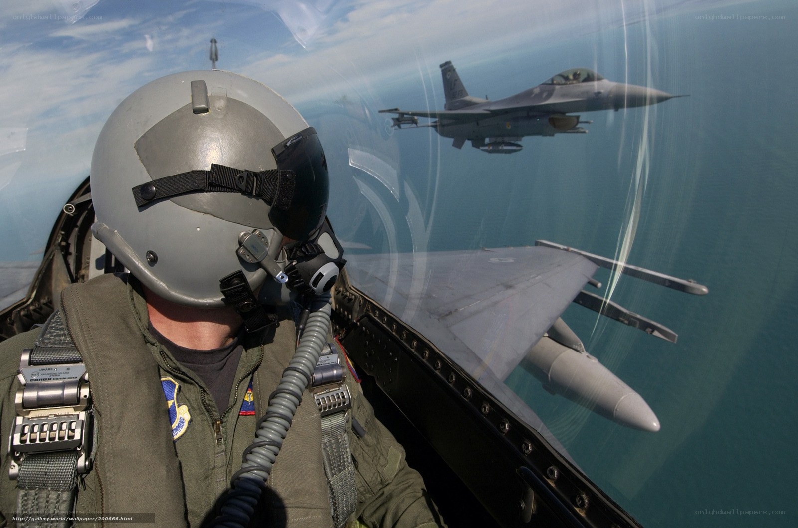 Pilot in fighter jet cockpit