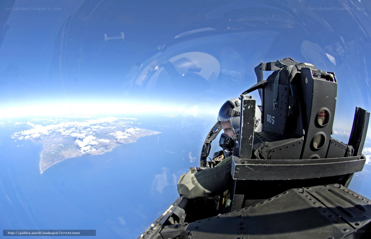 Pilot in fighter jet cockpit