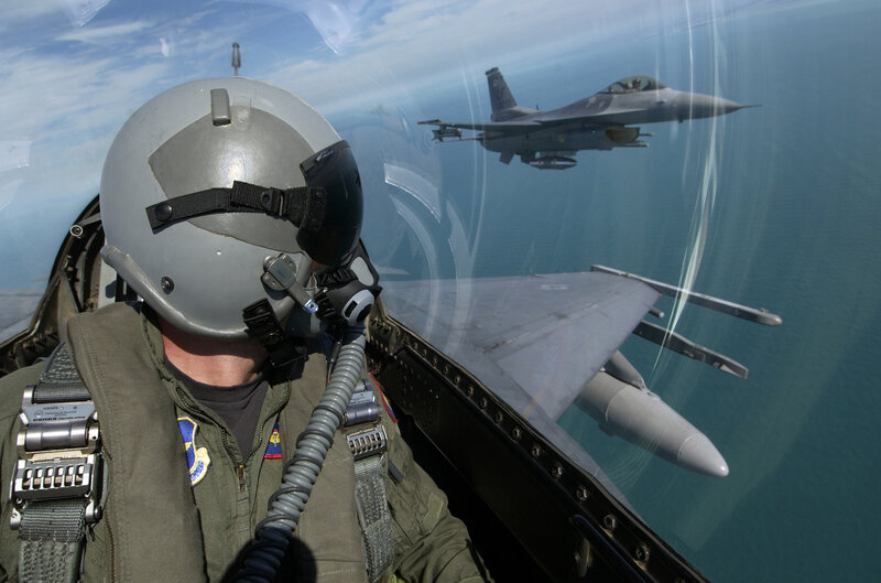 Pilot in Fighter Jet — Gray, Dramatic, Afternoon, Photograph, Fighter Jet