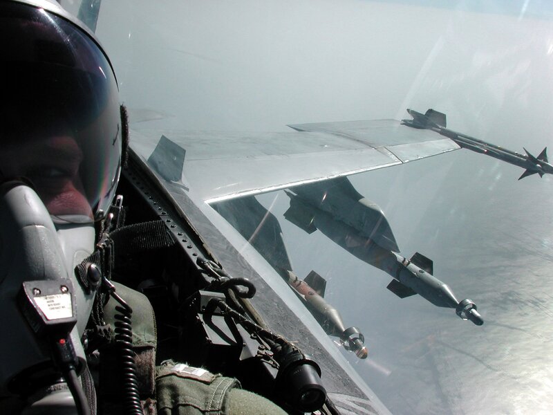 Pilot in Fighter Jet — Gray, Dramatic, Photograph, Missile