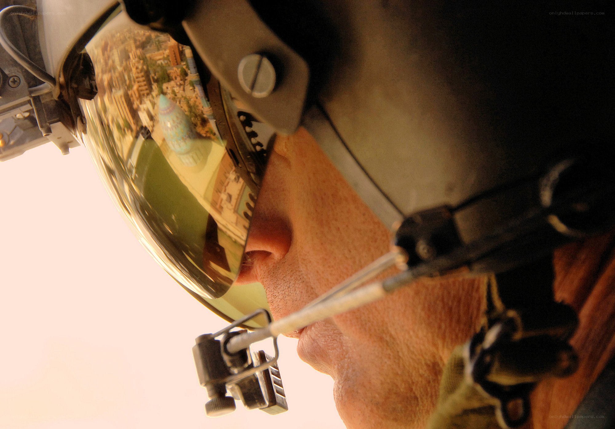 Pilot in helmet with city reflection