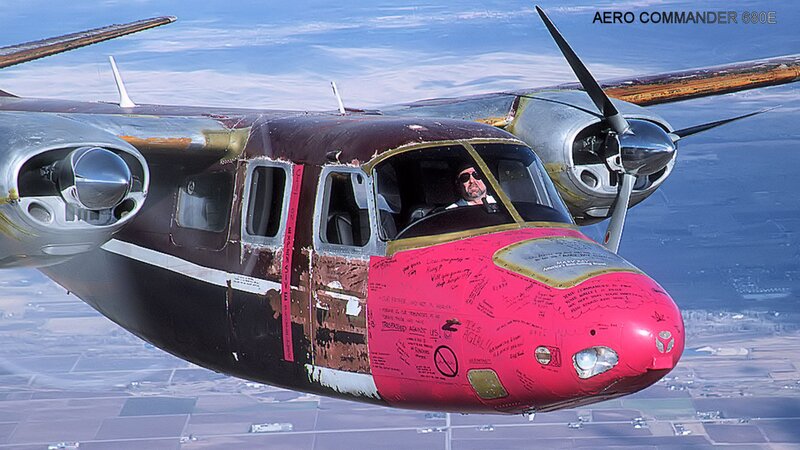 Pilot in Red Airplane