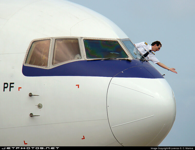 Pilot on Airplane Nose