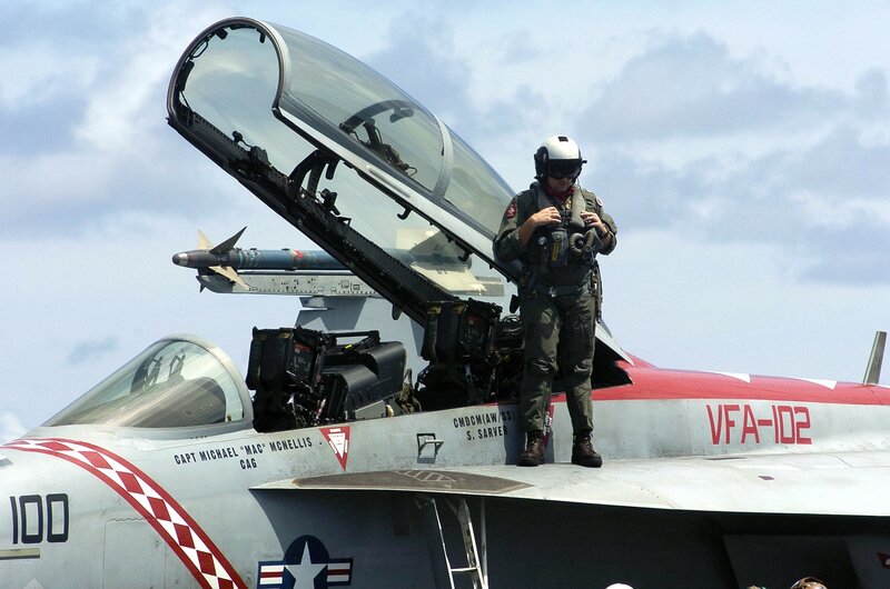 Pilot on Fighter Jet — Gray