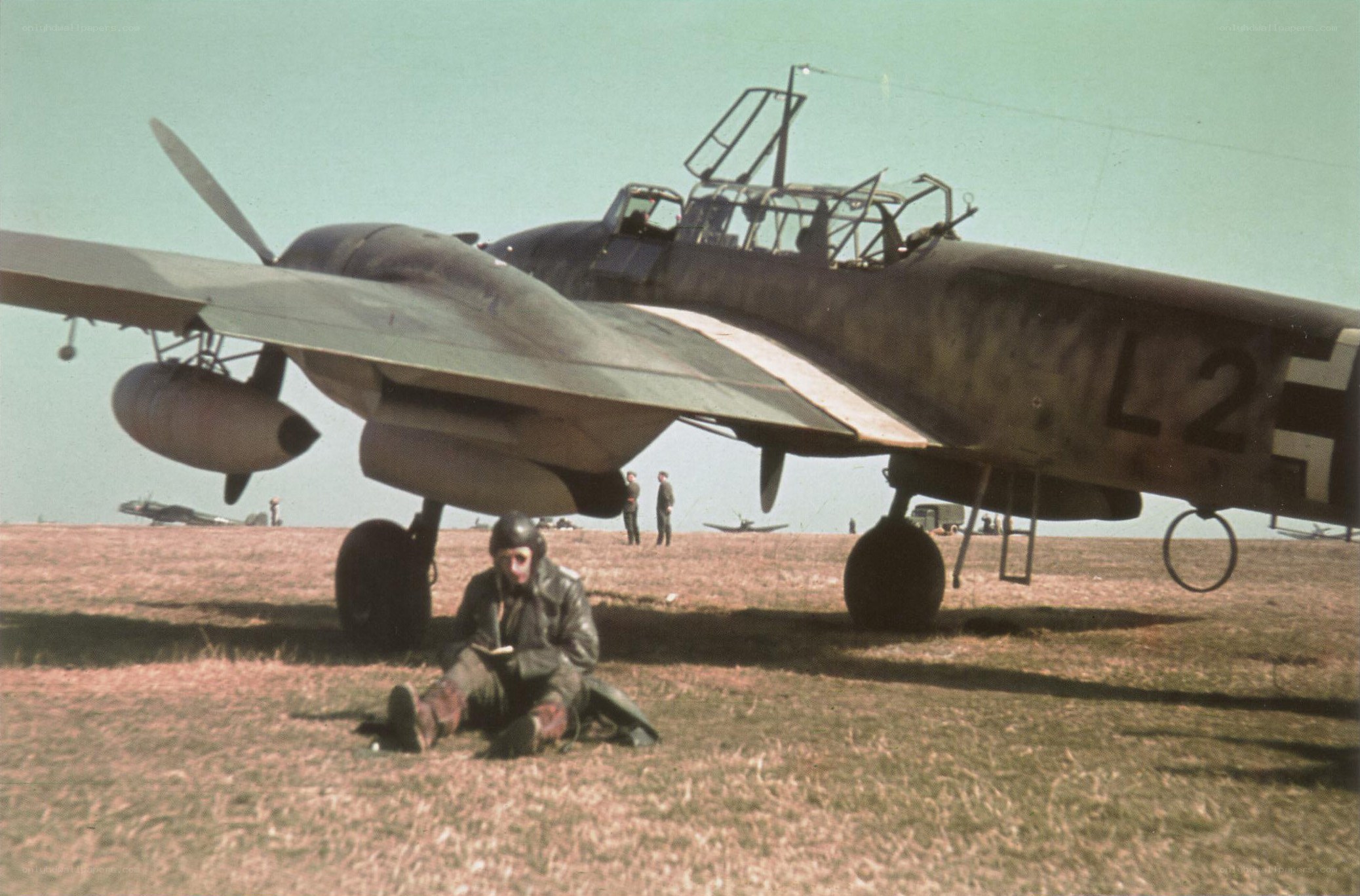 Pilot resting near aircraft
