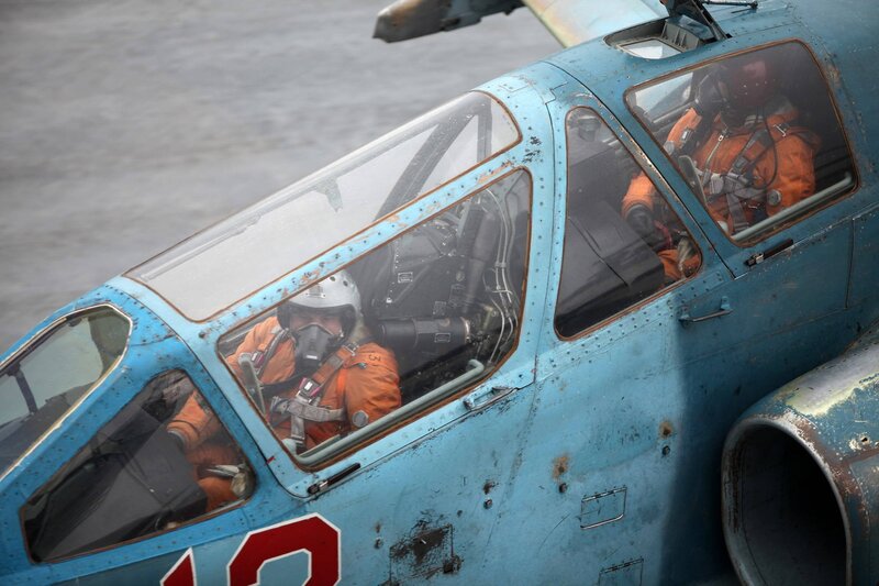 Pilots in a military jet cockpit