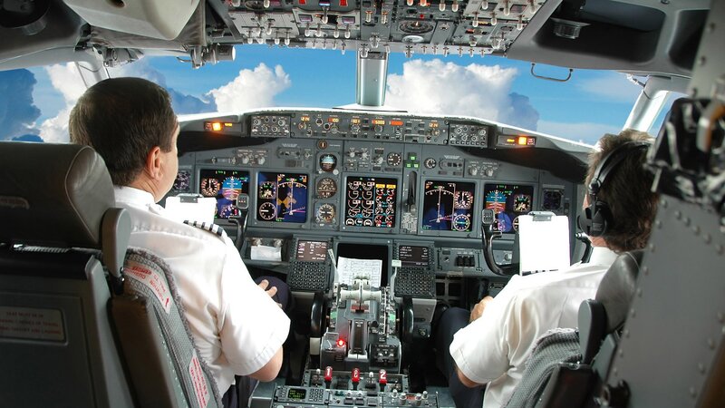 Pilots in airplane cockpit