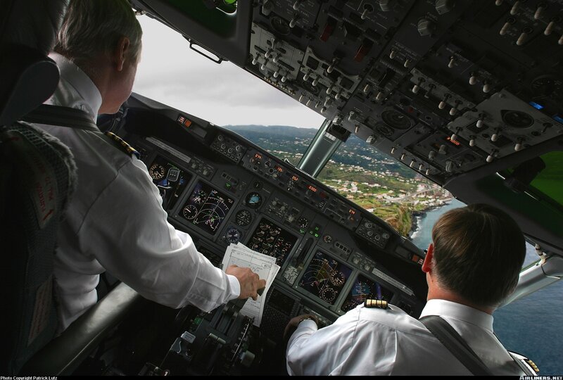 Pilots in cockpit during flight