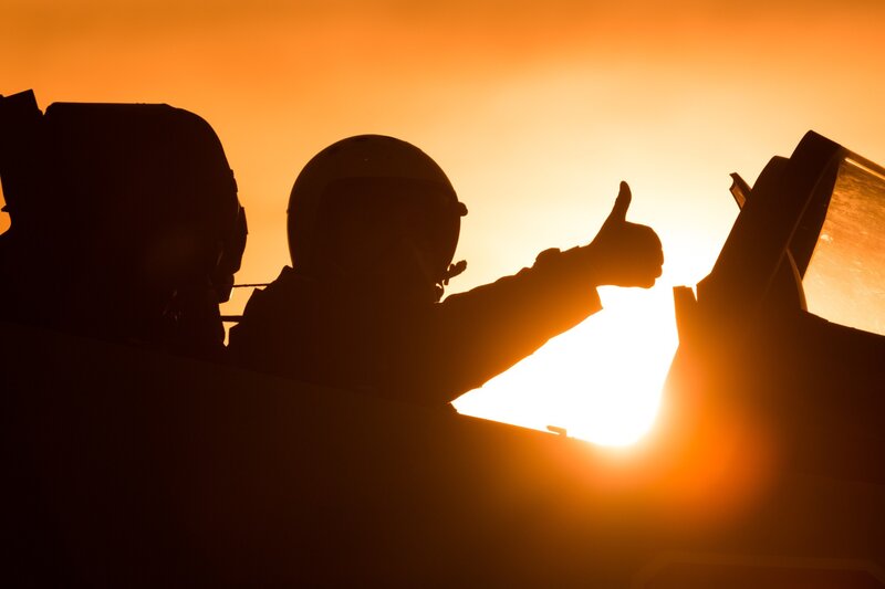 Pilots in Cockpit — Orange, Dramatic