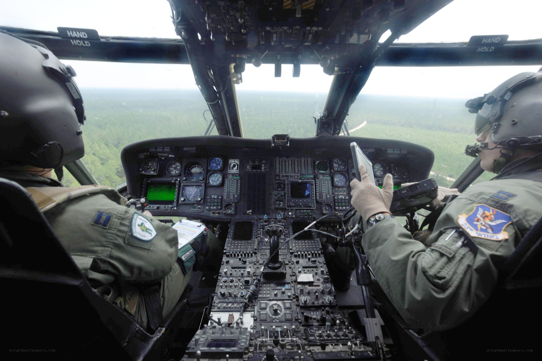 Pilots in helicopter cockpit