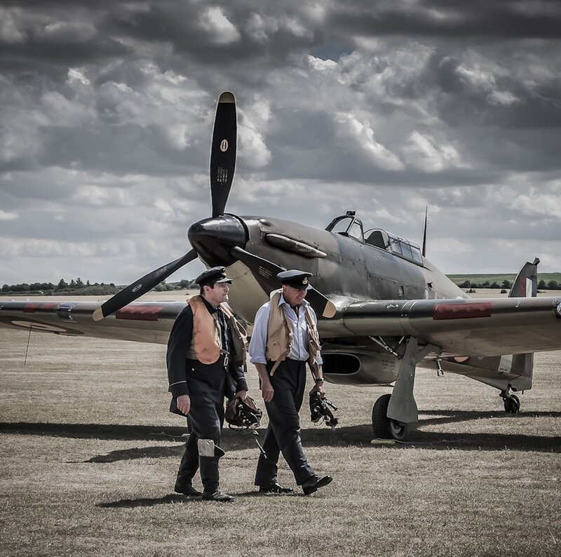 Pilots Near Vintage Plane