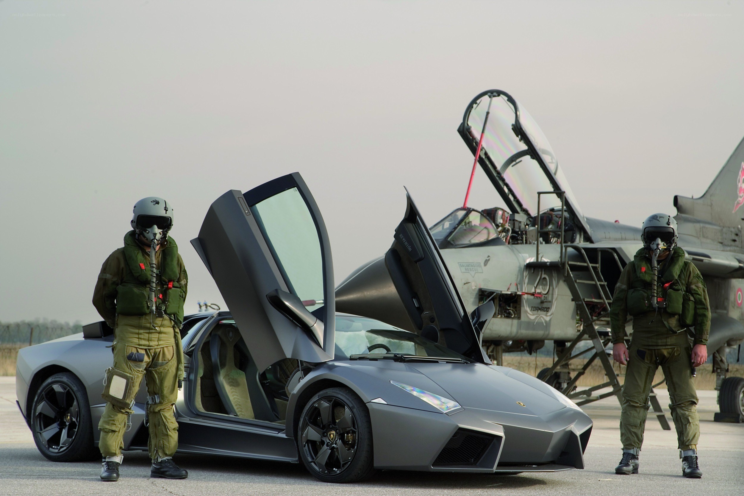 Pilots with Lamborghini and fighter jet