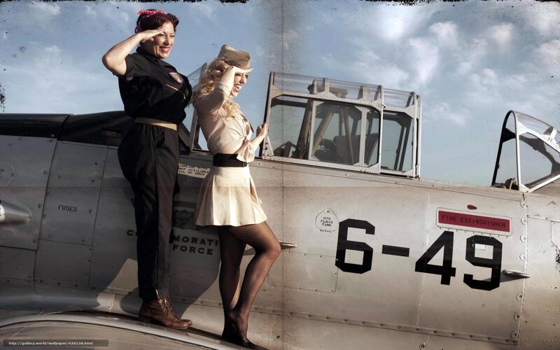 Pin-up girls with vintage plane