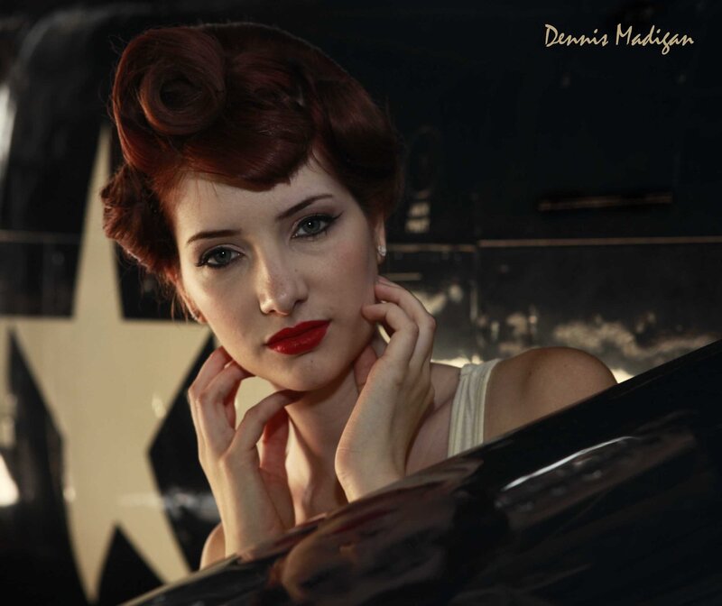 Pin-up woman by airplane