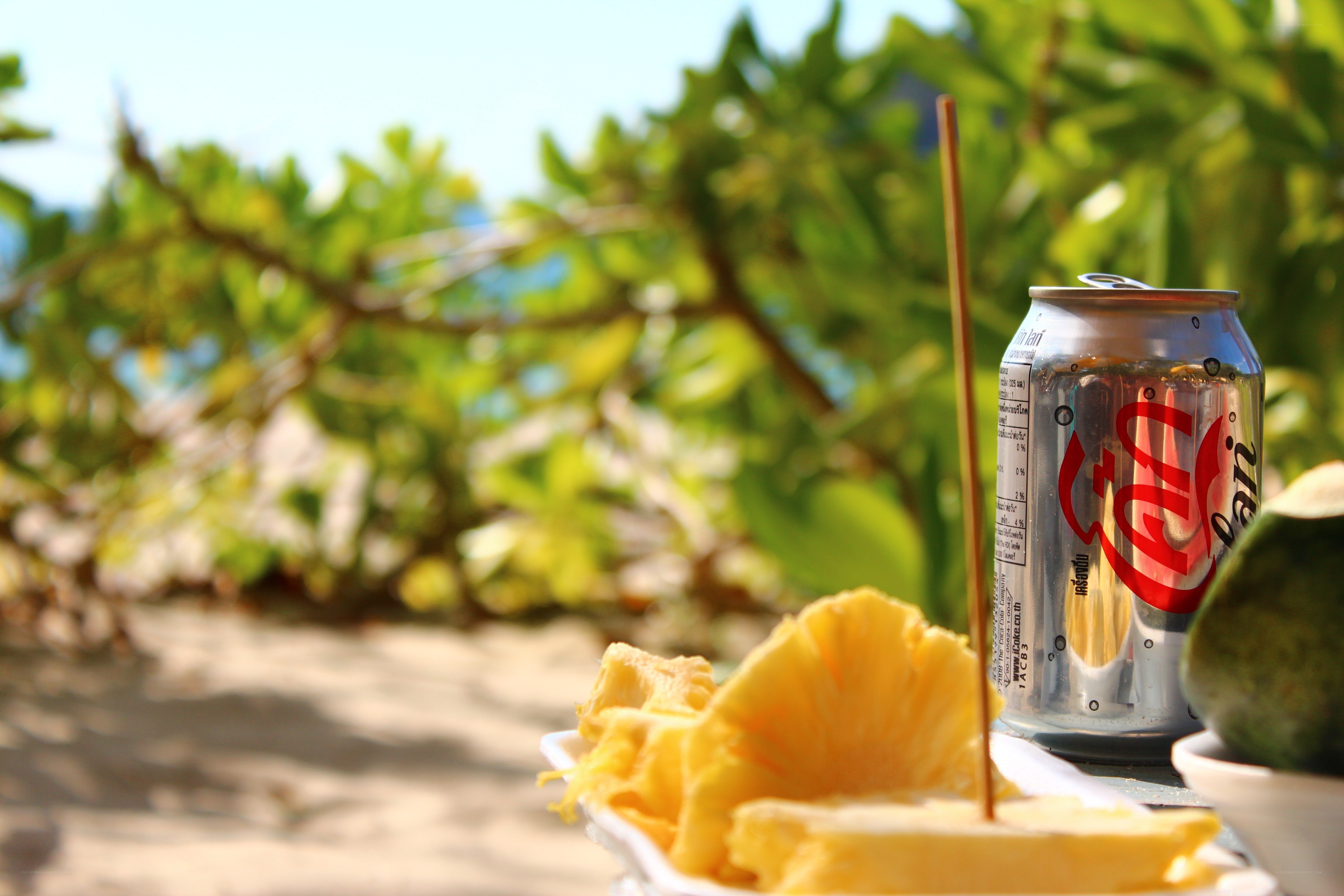 Pineapple and soda on beach
