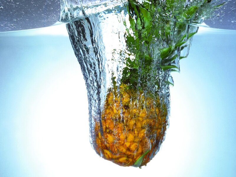 pineapple falling into water