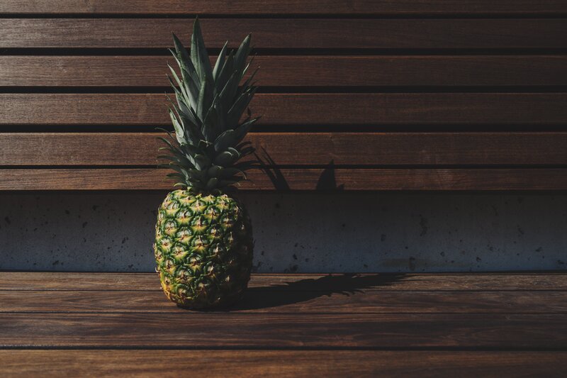 Pineapple on wooden surface