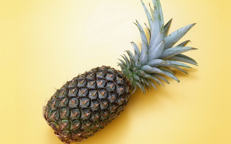 Pineapple on yellow background