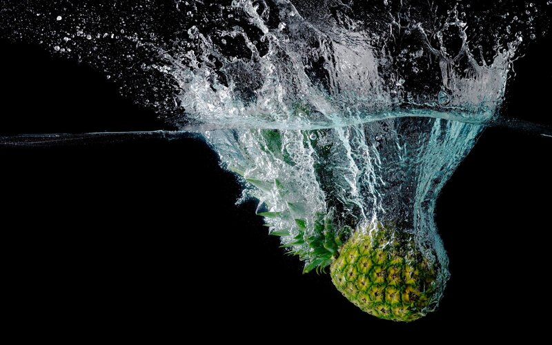 Pineapple splashing in water