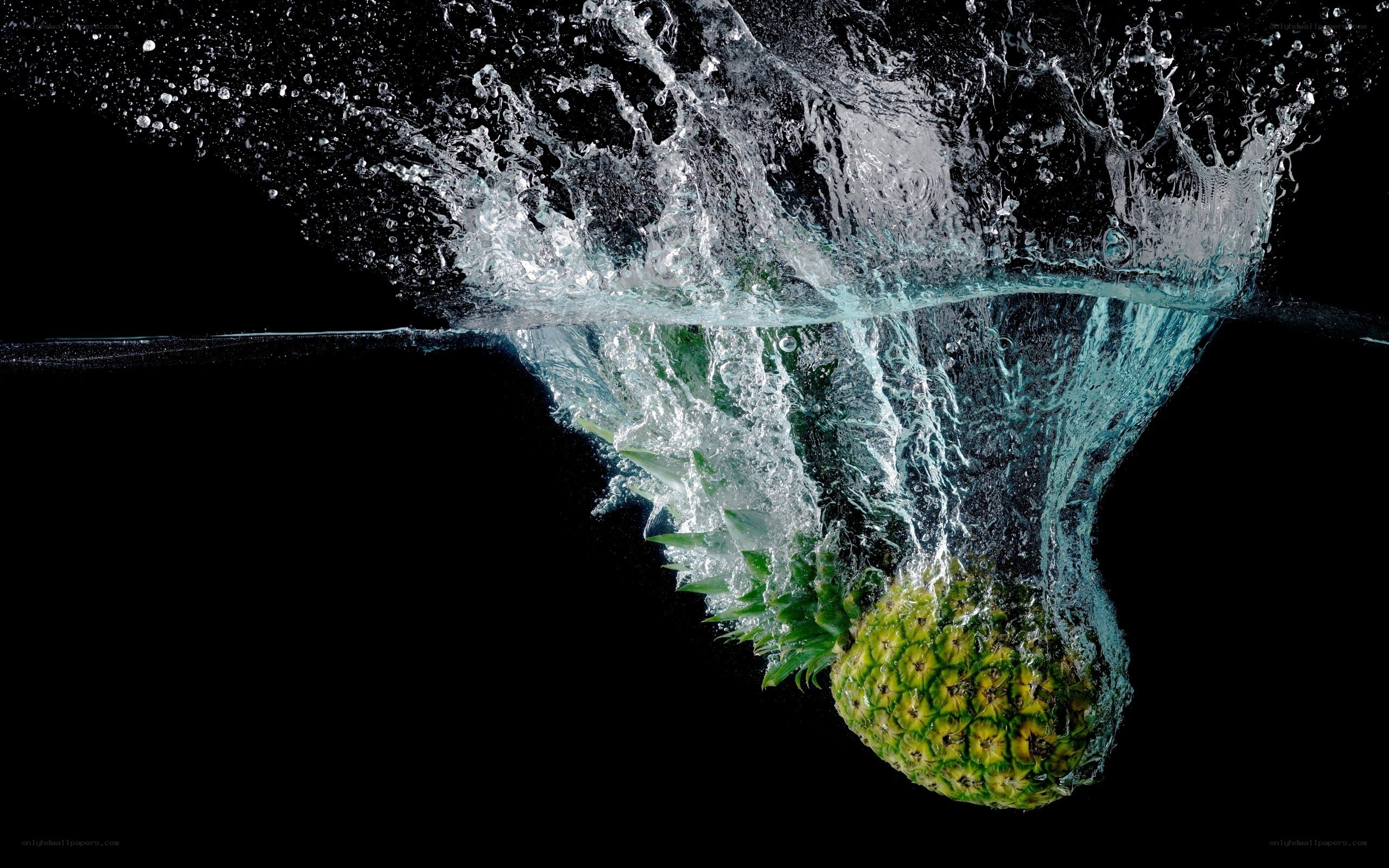 Pineapple splashing in water