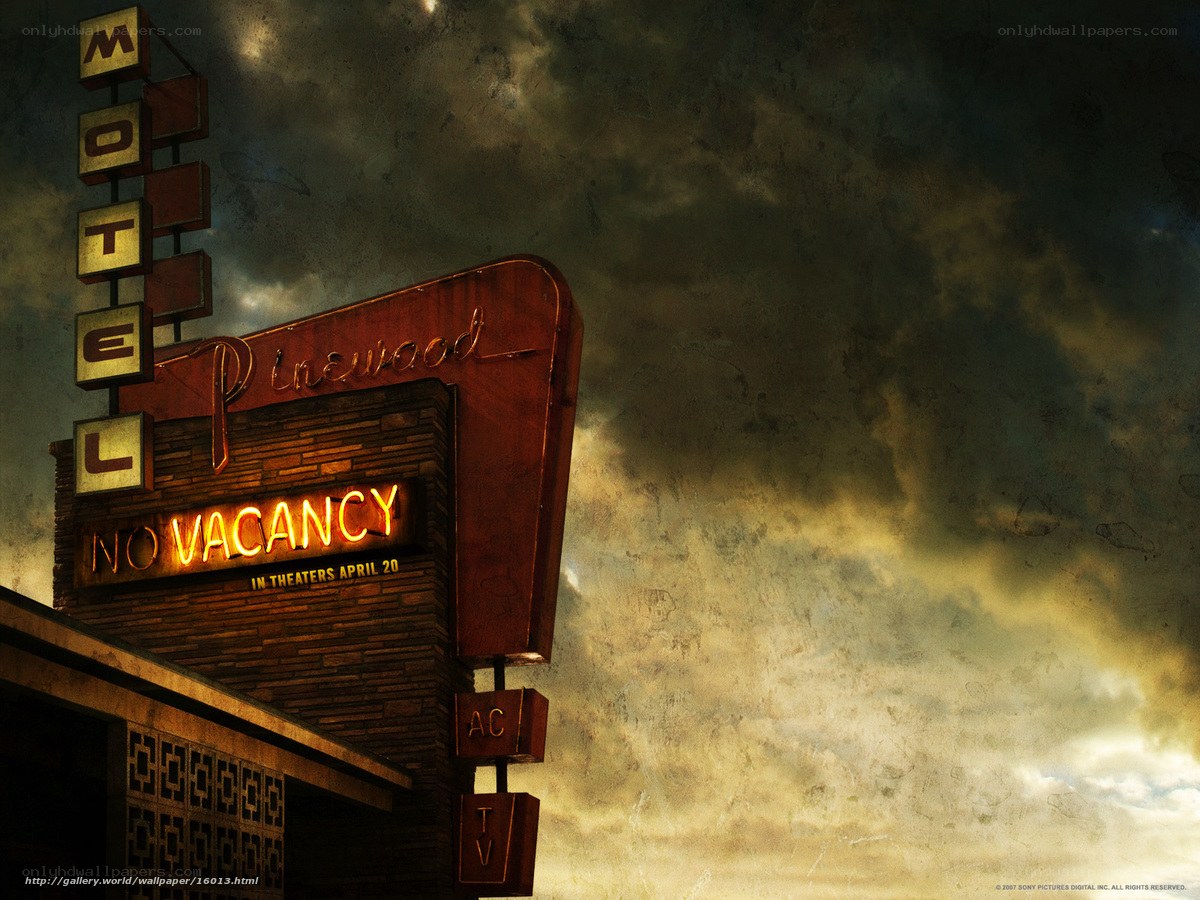 Pinewood Motel sign at dusk