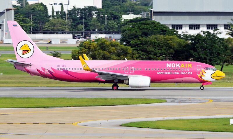 Pink Airplane on Runway