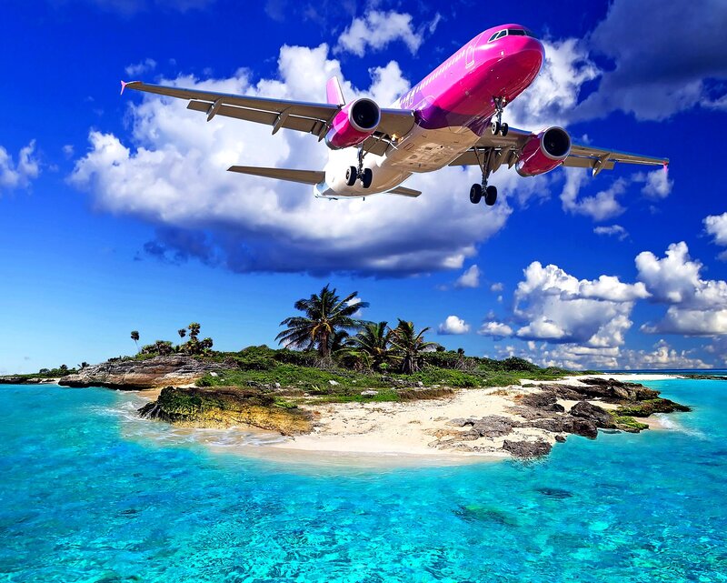 Pink Airplane over Island