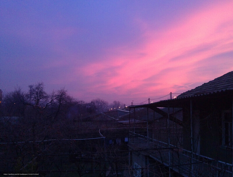Pink and purple sunset over rooftops