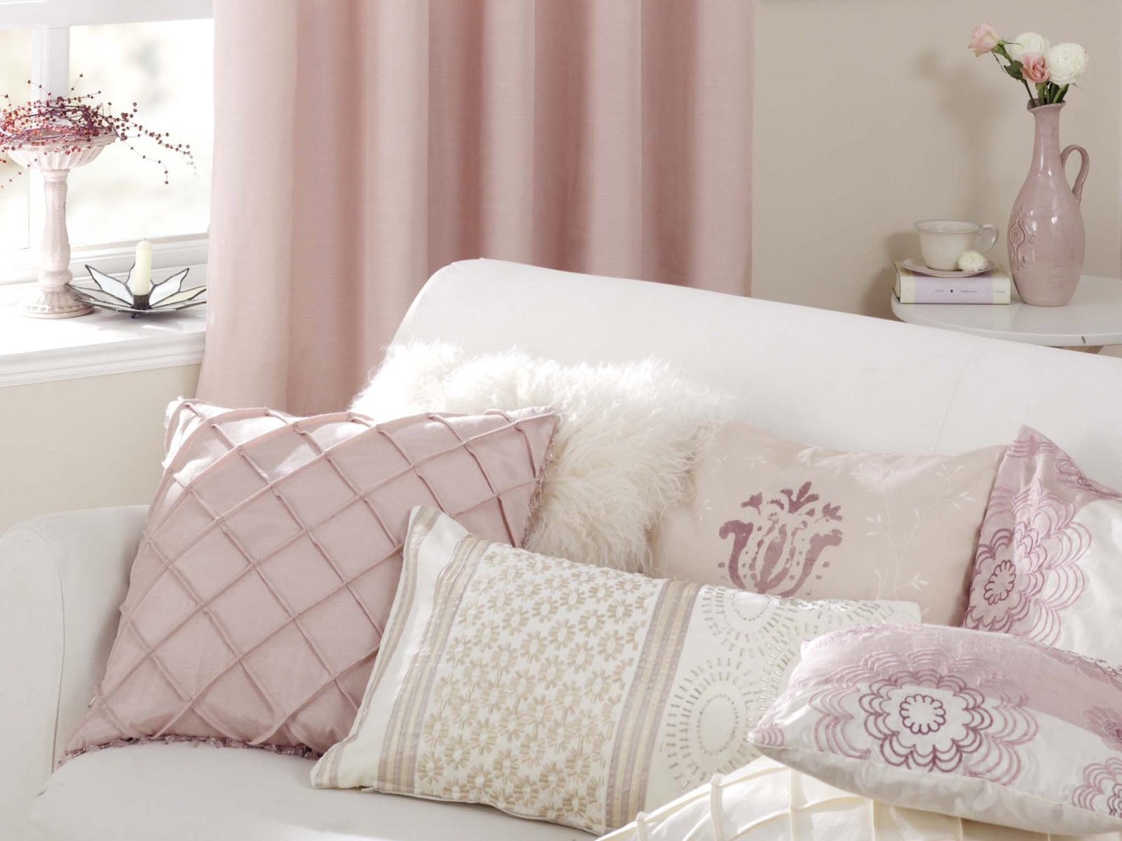 pink and white living room pillows