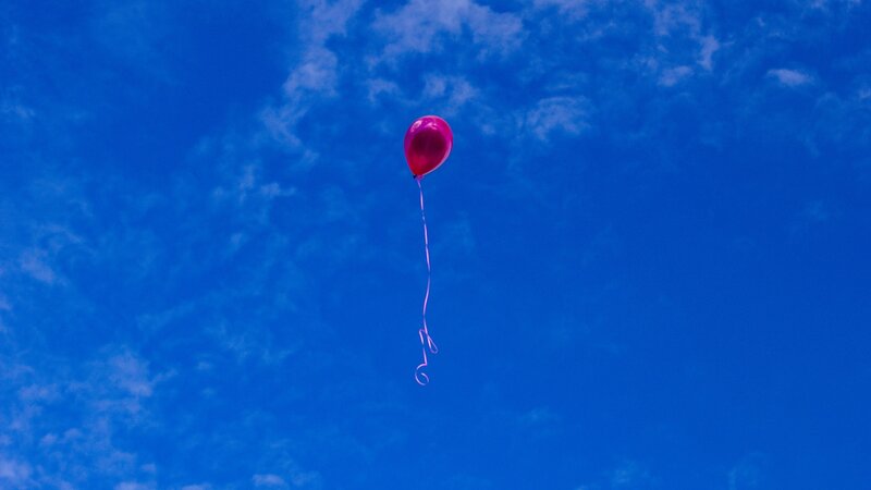 Pink Balloon in Sky