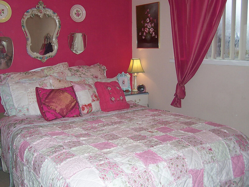 Pink bedroom with patchwork quilt